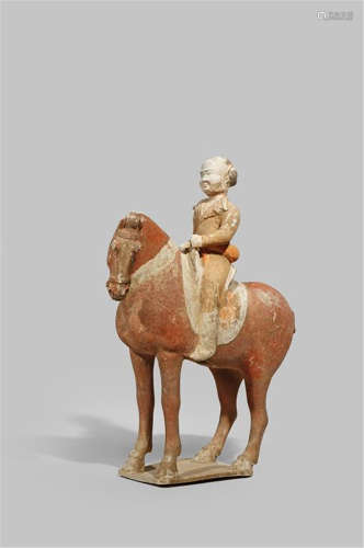 A CHINESE POTTERY MODEL OF A HORSE AND RIDER TANG DYNASTY 618-907 AD