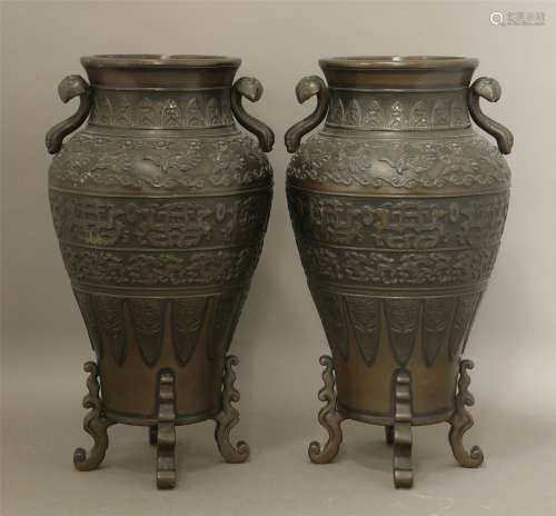 A pair of bronze vases