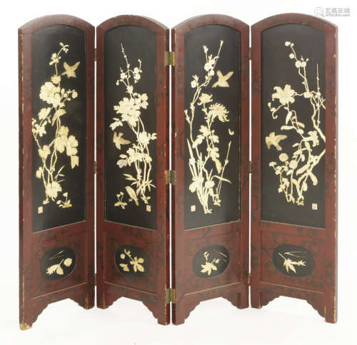 A black-lacquered four-fold screen