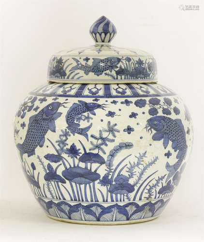 A large blue and white jar and cover