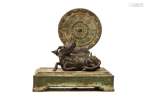 明   铜镜及麒麟镜托                                                                                                                                                       A CHINESE BRONZE MIRROR AND QILIN STAND.