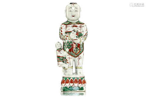 清康熙   五彩童子像                                                                                                                                             A CHINESE FAMILLE VERTE MODEL OF A STANDING BOY.