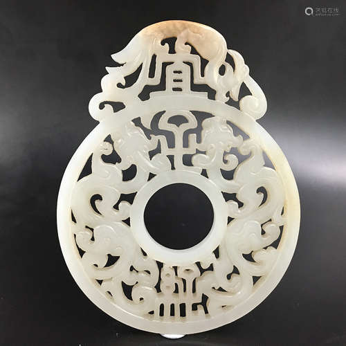 A PIERCED CHINESE JADE DRAGON PENDANT