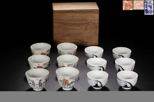 A SET OF FAMILLE ROSE AND BLUE AND WHITE CUPS