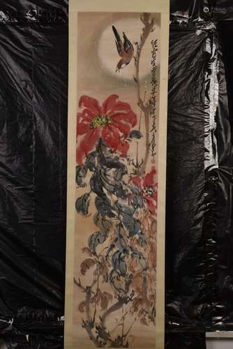 A CHINESE SCROLL PAINTING OF PEONY AND BIRDS