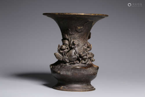 A BRONZE VASE CARVED WITH MYTHICAL BEASTS