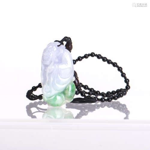 A JADEITE PENDANT CARVED OF FIGURE