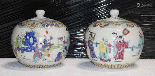 PAIR OF FAMILLE ROSE PORCELAIN COVERED URNS