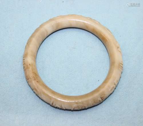 ANTIQUE CARVED JADE BANGLE