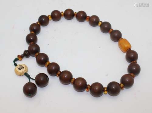 JINSINAN WOOD AND AMBER PRAYER BEADS