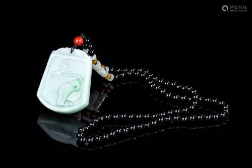 CELADON JADE CARVED PLAQUE WITH NECKLACE