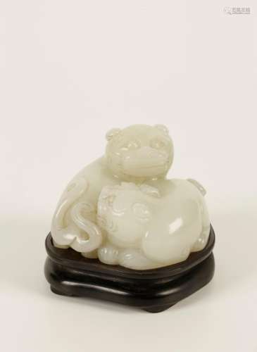 A CHINESE MUTTON FAT WHITE JADE GROUP OF A PAIR OF PLAYFUL LIONS