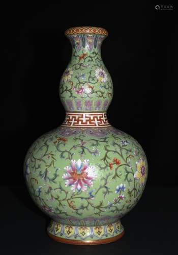 A FAMILLE ROSE GREEN GROUND GOURD VASE