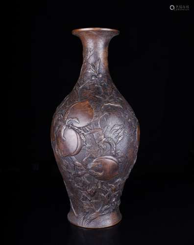 A CARVED BRONZE VASE