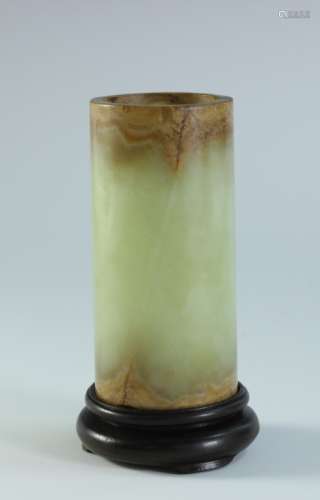 A YELLOW JADE BRUSH POT WITH WOOD STAND