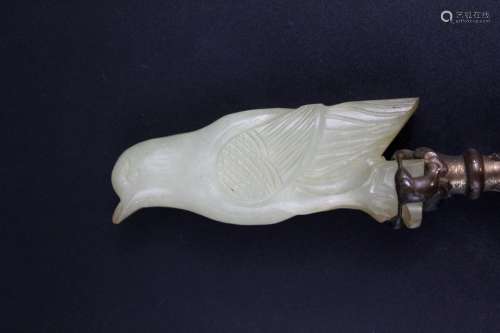 Chinese caved jade figure of a bird mounted on lamp.