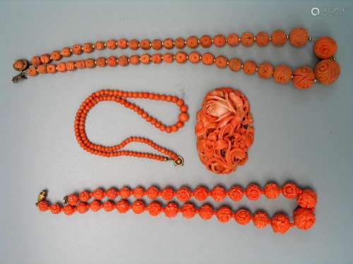Carved coral necklaces and brooch.