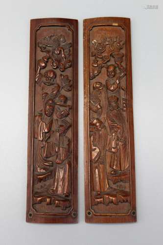 Two Chinese carved bamboo wrist-rests.