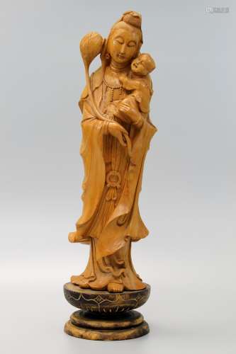 Chinese carved wood figure of Guanyin holding a baby