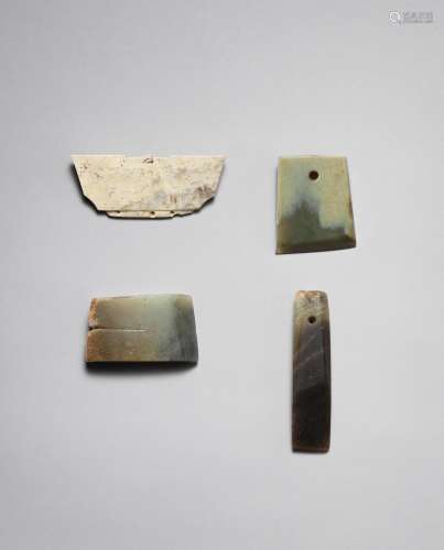 A jade 'crown' ornament and three jade axe-heads