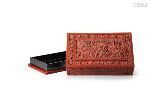 A large and rare Imperial cinnabar lacquer 'Buddhist lions' box and cover