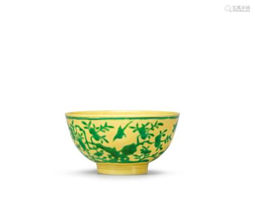 A green and yellow-glazed 'birds and peach' bowl