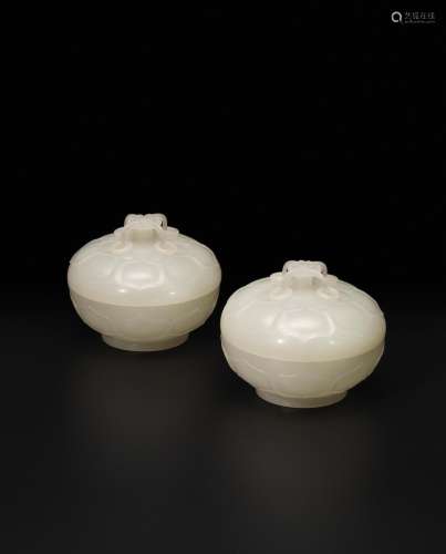 A rare and exquisite pair of white jade 'lotus' bowls and covers, lian