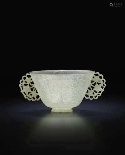 A rare pale green jade two-handled bowl