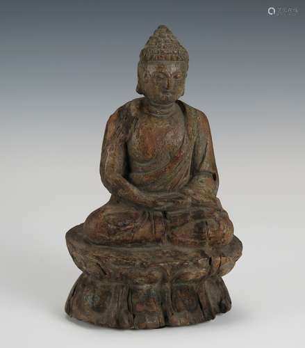 A WOODEN CARVED BUDDHA