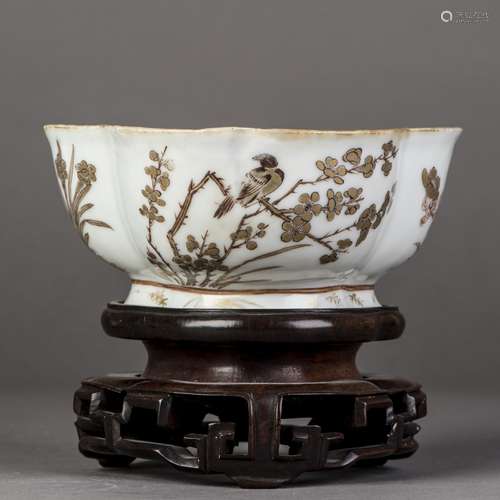 A GILT FLORAL AND BIRD MOTIF BOWL WITH HARDWOOD BASE