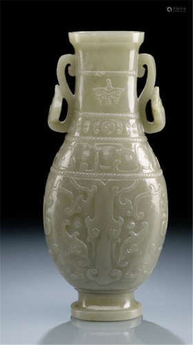 A JADE VASE IN HU SHAPE IN ARCHAIC STYLE WITH RUYI HANDLES, China, 18th/19th ct