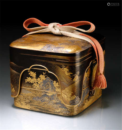 A THREE-TIERED LACQUERED BOX AND COVER, Japan, late 18th Ct., fine gold and silver lacquer decoration of a landscape with a rocky shore and mountains, details inlaid in silver. The sides with metal rings and a textile ribbon used for fastening the cover - Provenance: Purchased from Nagel Auktionen, Stuttgart, Sale 277, 06.12.1978, no. 2120 - Minor wear, some metal inlays lost