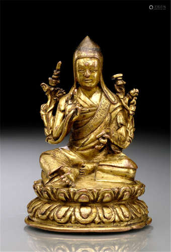 A GILT-BRONZE FIGURE OF SAKYA PANDITA, Tibet, 16th ct