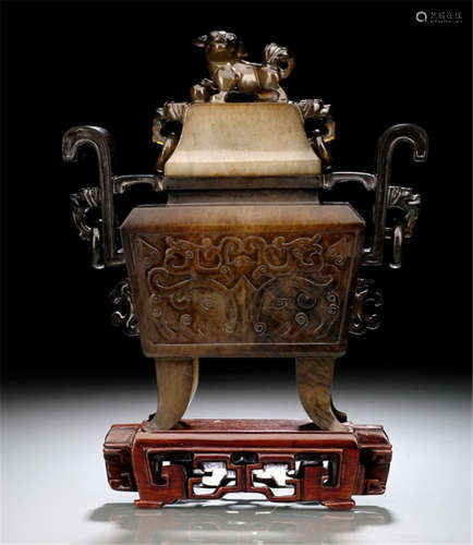 A JADE CENSER WITH COVER ON A WOOD STAND