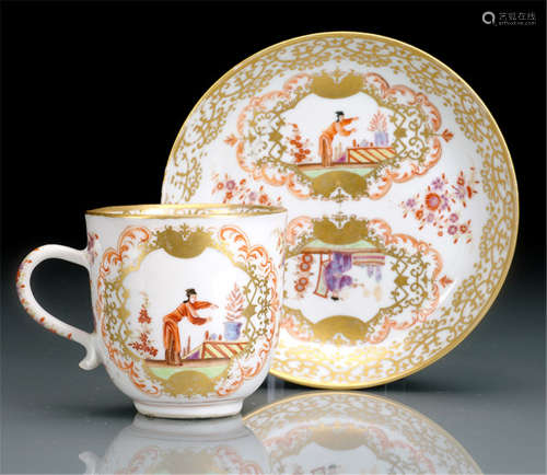 A RARE CUP AND SAUCER WITH GERMAN 