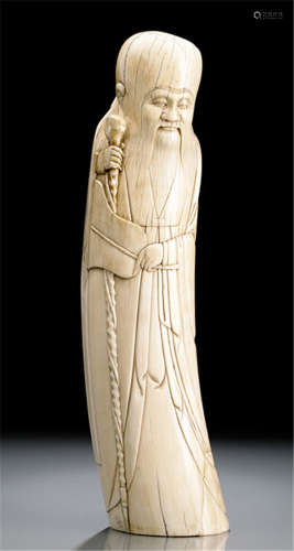 AN IVORY CARVING OF STANDING SHOULAO HOLDING A STAFF
