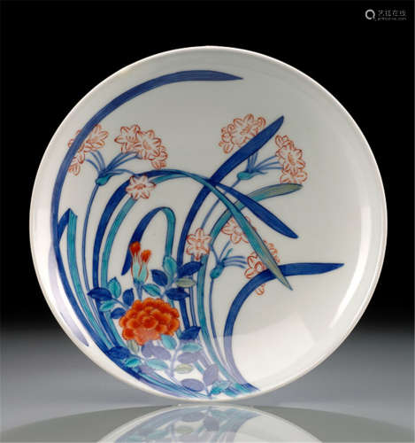 A NABESHIMA PORCELAIN DISH, Arita, signed, Japan, 20th Ct., painted with three orchids and a peony in underglaze blue, iron red and turquoise enamels - Property from a French private collection, acquired at Beaussant Portier, 19th March 2008, lot 151 - Partially restored