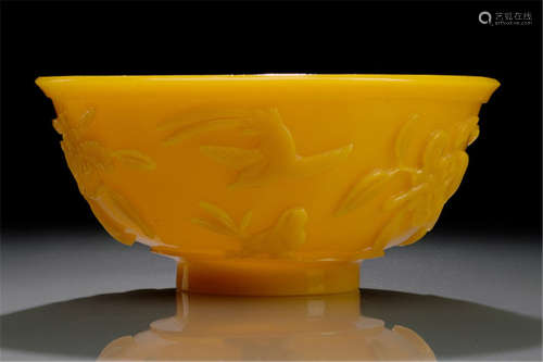 A YELLOW BEIJING GLASS BOWL DECORATED WITH FLOWERS AND BIRDS