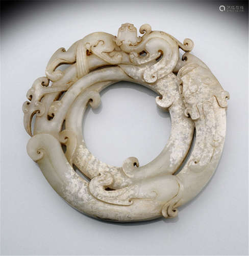 JADE CARVING OF INTERTWINED DRAGONS, PARTIALLY SINTERED, China, possibly Ming dynasty or earlier-Property from a German private collection, acquired before 1996-Traces of age, slightly chipped
