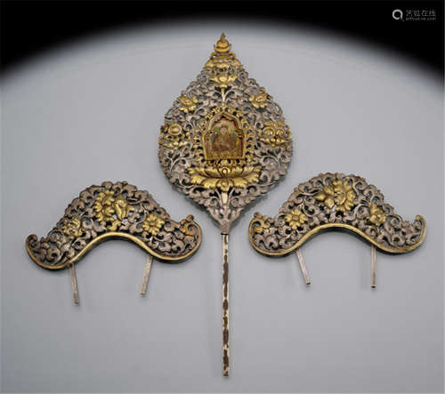 THREE PARCEL GILT-SILVER EMBOSSED ORNAMENTS FOR A TRAVEL TORMA, TIBET, ca