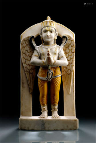 A POLYCHROME ALABASTER FIGURE OF GARUDA, North-India, 19th/20th Ct., standing in samabhanga on a base with both hands in anjalimudra, pair of wings behind, wearing dhoti, snake ornaments, his head displaying a serene expression with hooked nose and his head topped with a crown- Property from an old Bavarian private collection, acquired between 1960 and 1990