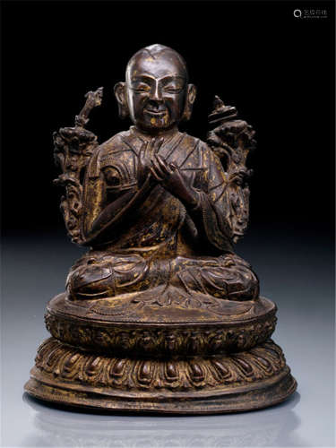 A BRONZE FIGURE OF A LAMA, TIBET, 16th/17th ct