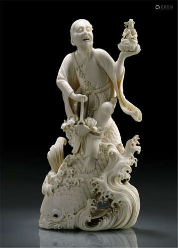 AN IVORY OKIMONO OF KINKO SENNIN ON A CARP, Japan, signed Hôgyoku, Meiji period, the figure of the immortal is standing on a carp, that is leaping out of breaking waves, holding a basket with flowers and a statue of Kannon in his raised, left hand - Partly fine hairline cracks, otherwise good condition