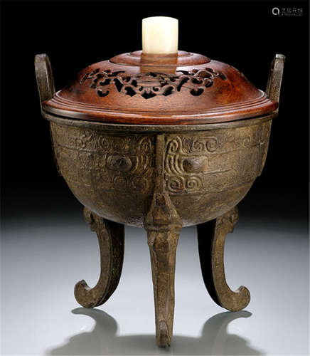 A BRONZE CENSER IN SHAPE OF A DING IN ARCHAIC STYLE, China, Ming dynasty, wood cover with stone handle-Property from a German private collection, assembled between 1990 and 2015-Corrosion