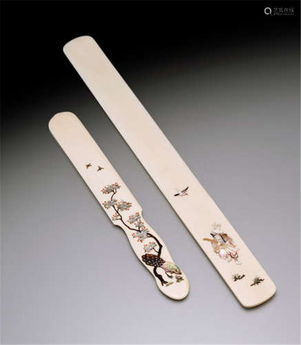 TWO IVORY AND SHIBAYAMA PAPER KNIVES, Japan, one signed with kaô, Meiji period, each one variously decorated with inlaid birds, insects and various plants and flowers, including mother-of-pearl and coral - Minor wear, otherwise good condition