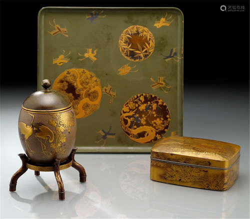 A LACQUERED WOOD TRAY AND TWO BOXES WITH COVERS, Japan, late Edo/Meiji period, the tray with fine gold lacquer decoration of cranes and the three 'friends of winter', one lacquered box with gold lacquered decoration of cottages in a mountainous landscape, the other box made of an ostrich egg with wood cover and gold lacquer decoration of a pair of cranes - Partly traces of wear