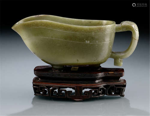 AN ARCHAISING 'YI'-SHAPED JADE VESSEL, China, 18th/19th ct