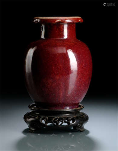 A COPPER-RED VASE WITH LOBED RIM