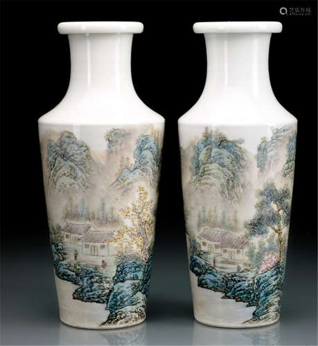 A PAIR OF PORCELAIN VASES DECORATED WITH LANDSCAPES