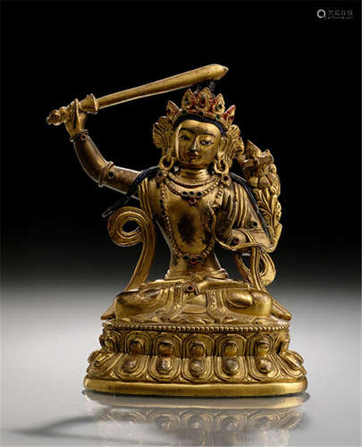 A GILT-BRONZE FIGURE OF MANJUSHRI, TIBETO-CHINESE, 18th ct